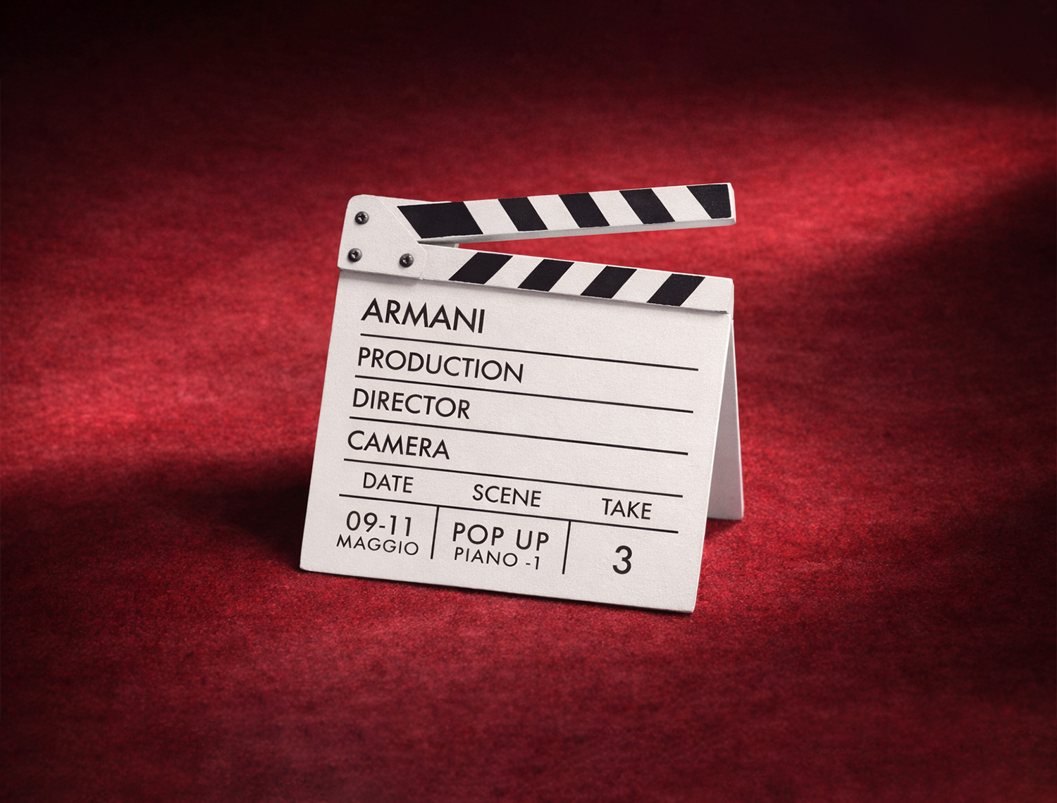 Custom printed activation materials designed to match the Armani In the Spotlight visual identity.