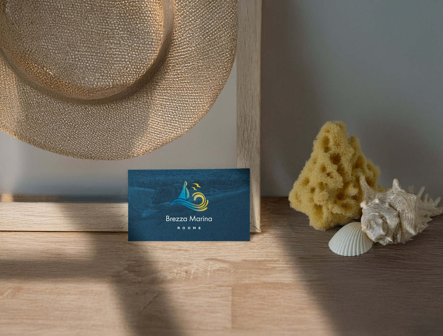 Brezza Marina Rooms business card design with coastal styling