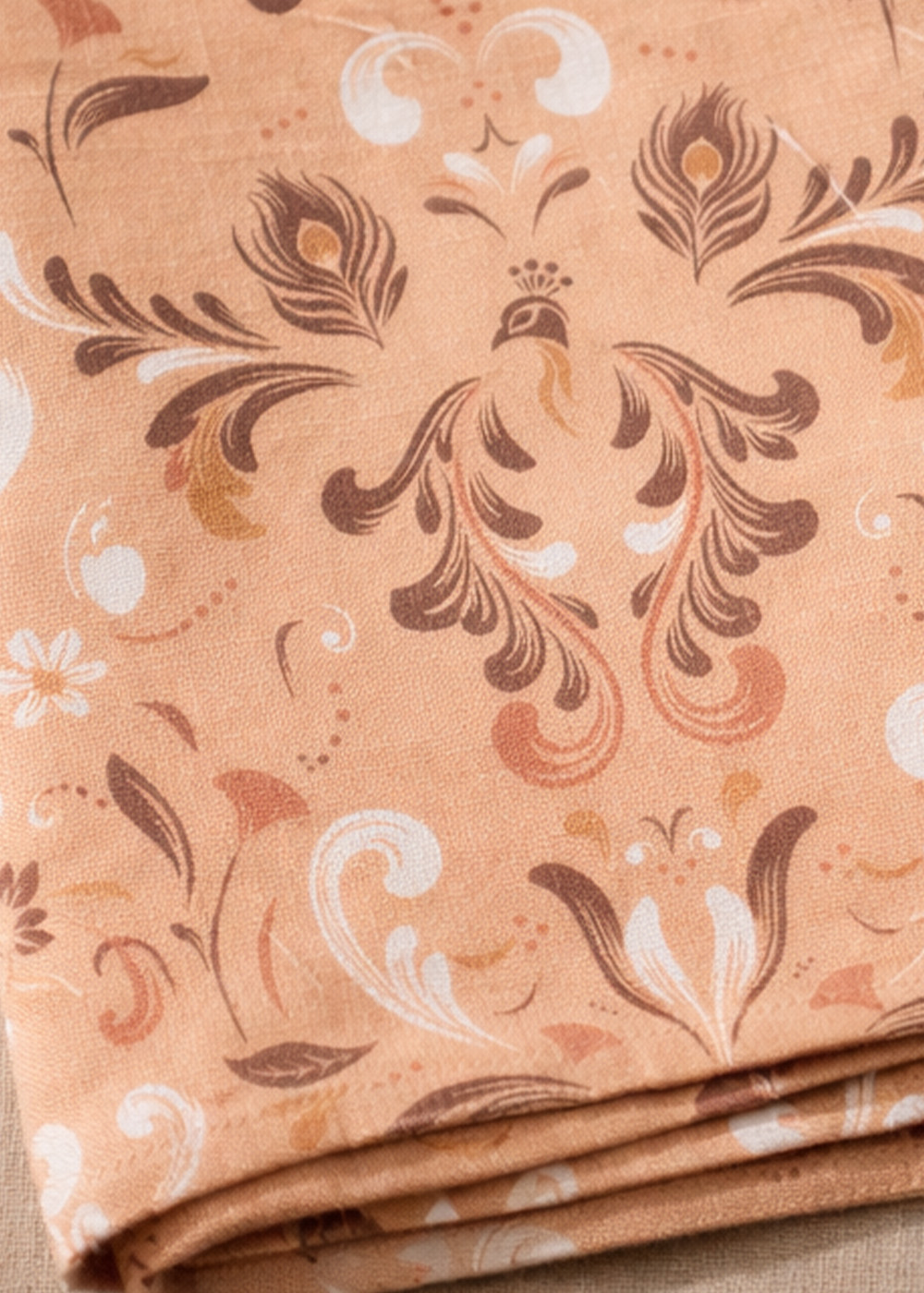 Heraldic textile pattern shown on a napkin detail.